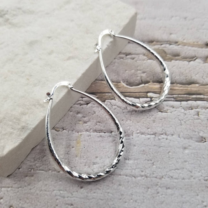 Treasure Wholesale - Textured Yellow Gold & Silver Oval Hoop Earrings: Silver